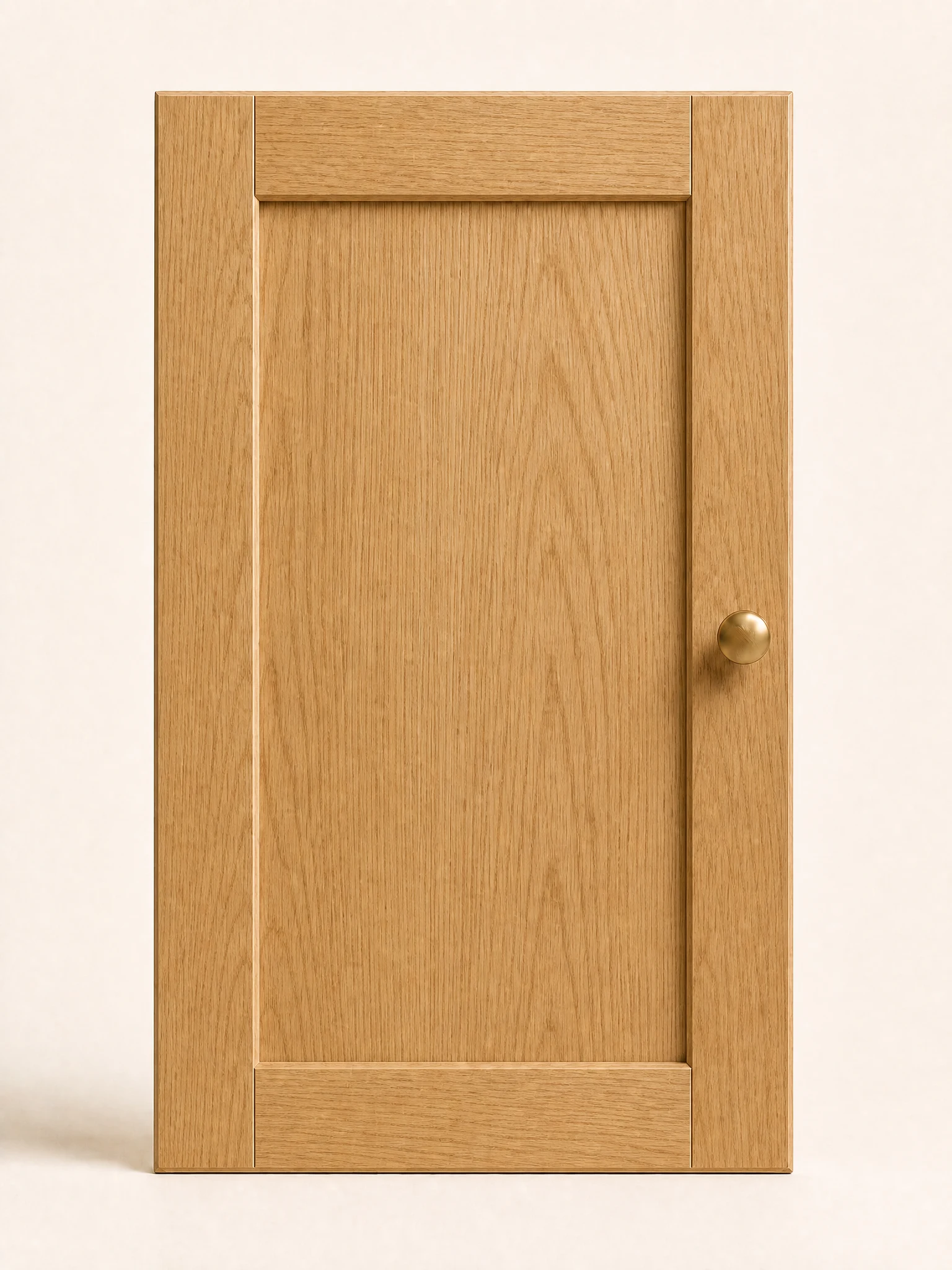 Natural oak Shaker cabinet door sample with a brass knob.