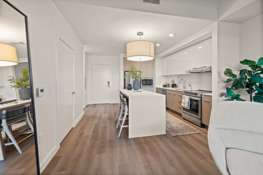 Dallas Texas glossy white slab kitchen renovation with L-shaped layout and white quartz island